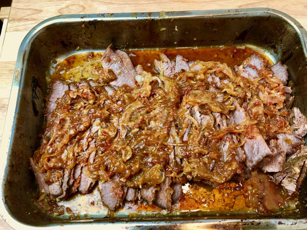 Thinly Slice the Brisket.  Put back in the Pan and cover with Cooked Onions.