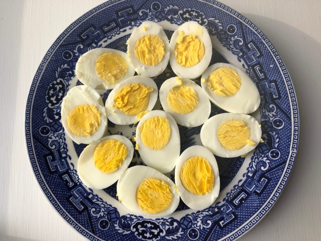 peel hard boiled eggs & cut in half vertically