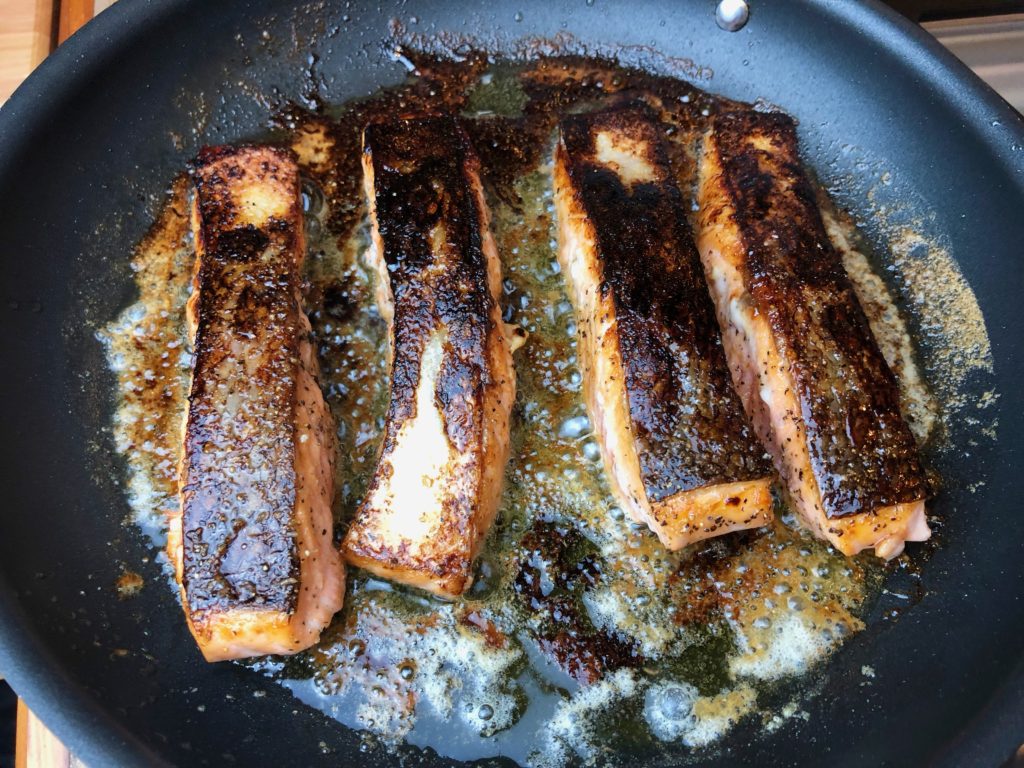 place salmon in pan skin side down and then turn