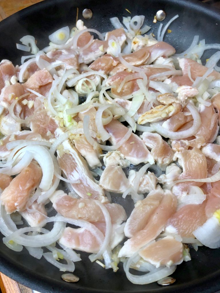 cook sliced chicken w garlic and onions