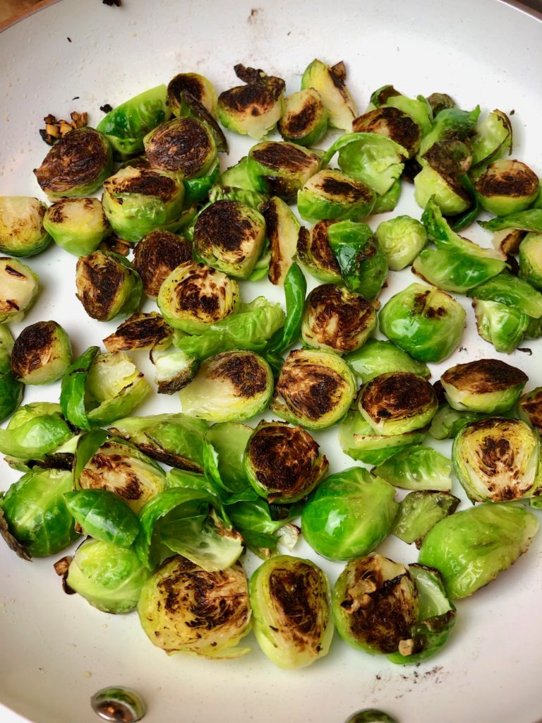 browned cut-side of brussel sprouts turned to cook other side with pepper added. spicy brussel sprout