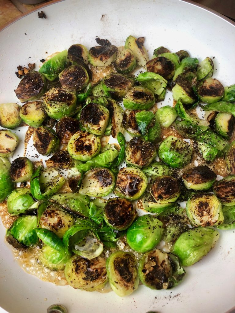 cooked brussel sprouts with pepper and then honey added. spicy honey-glazed brussel sprouts

