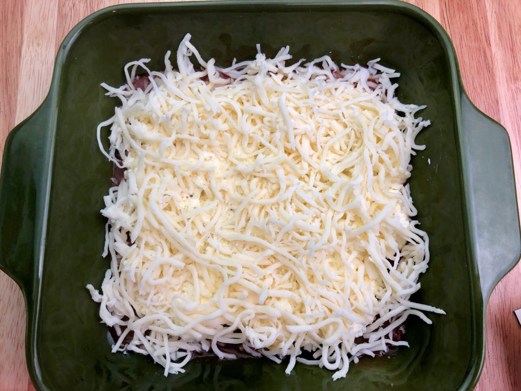 1st layer of shredded mozzarella for lasagne