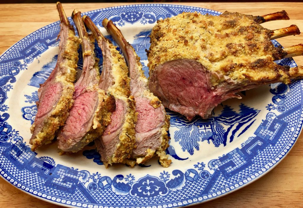 plated rack of lamb sliced into a few chops