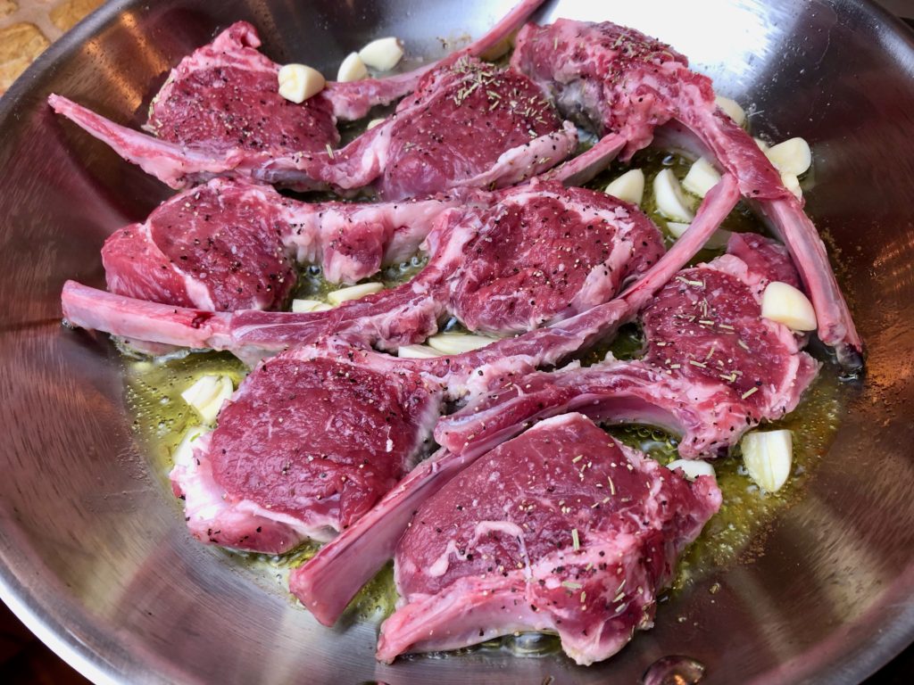 cooking lamb chops in olive oil with whole garlic cloves