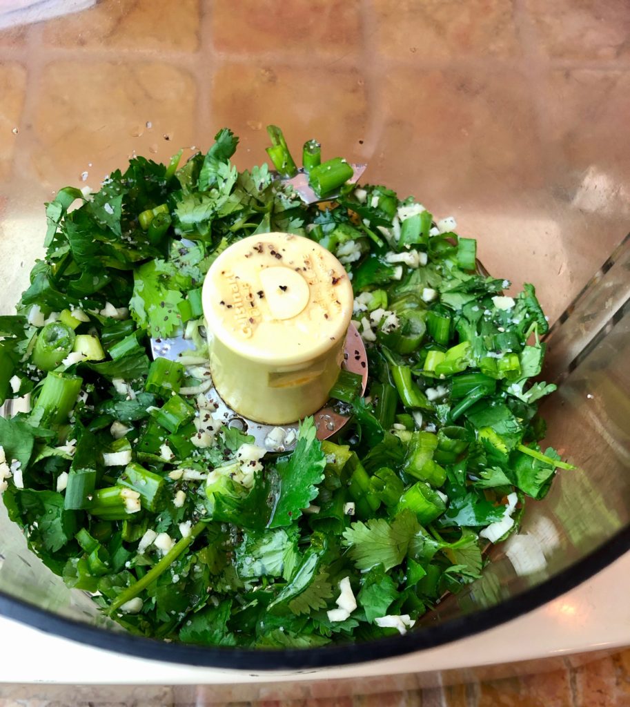 Combine the cilantro, chives, garlic, vinegar and olive oil in the food processor. 