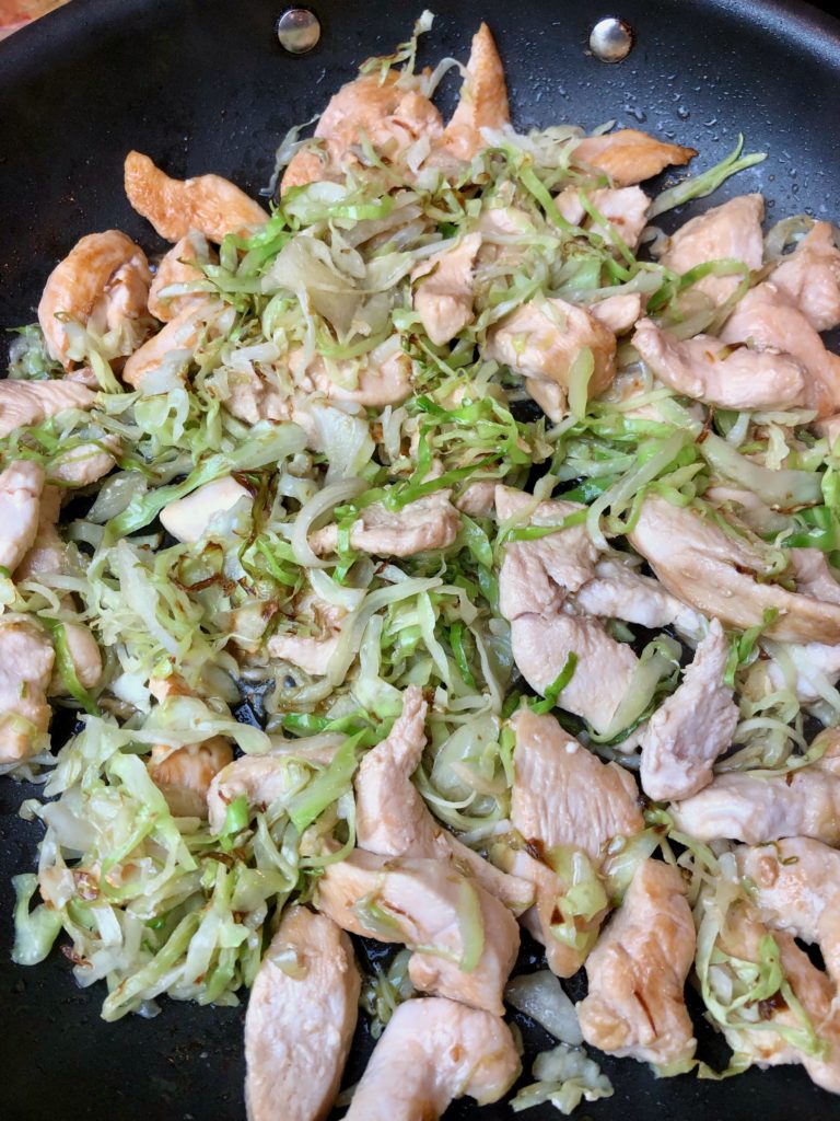 cabbage and chicken combined in pan