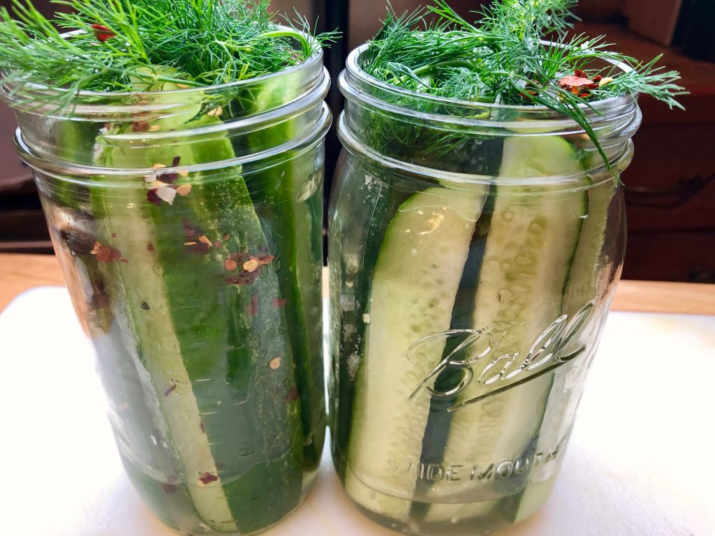 Add Cucumbers, Spices and Dill to the Jars