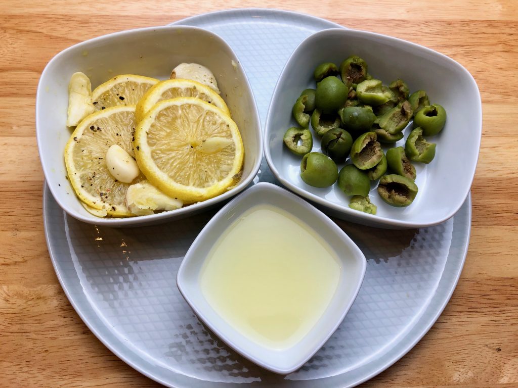 marinated lemon slice, green olives and lemon juice