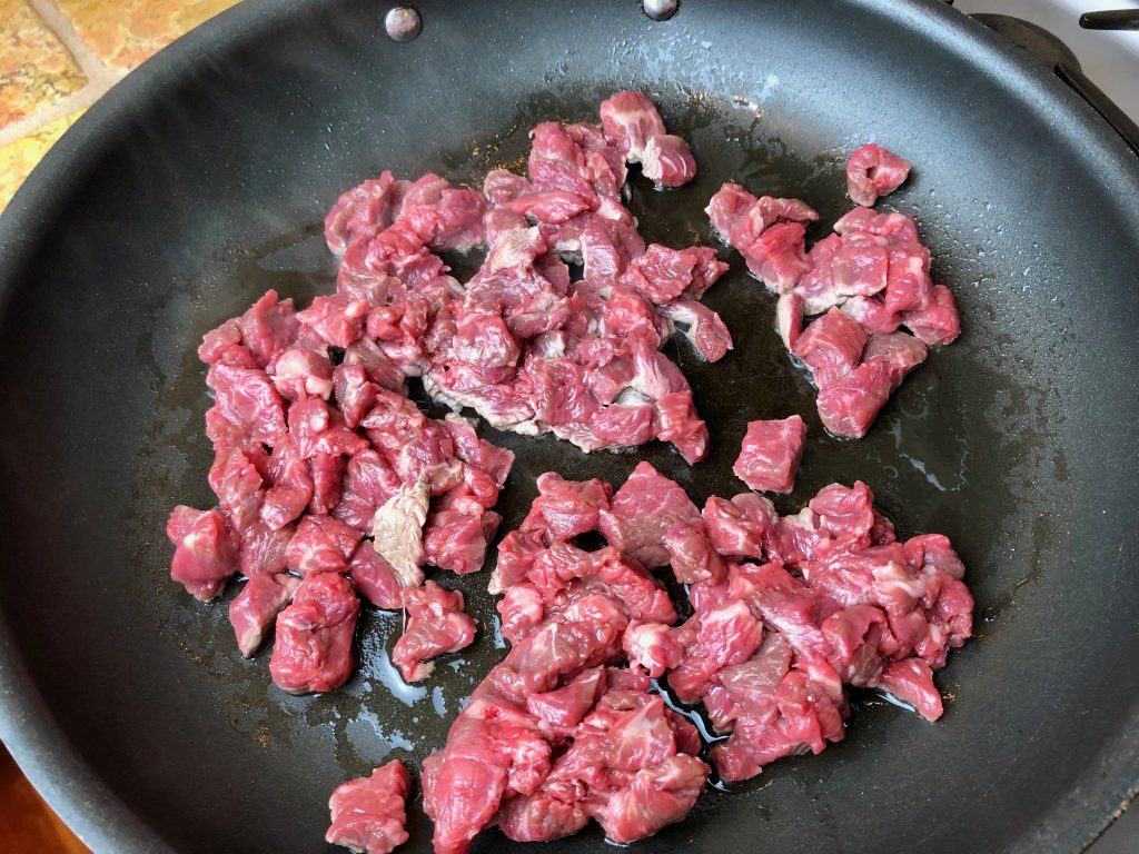 cooking chopped steak cubes