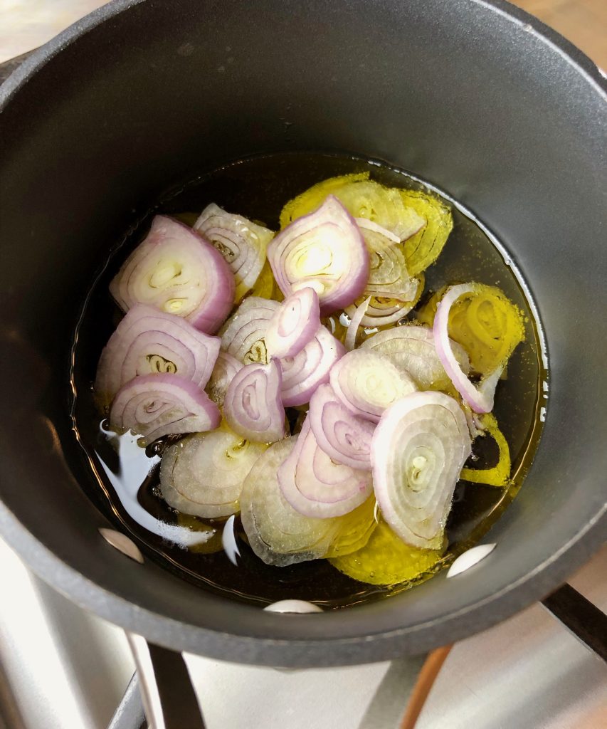 sliced shallots in olive oil