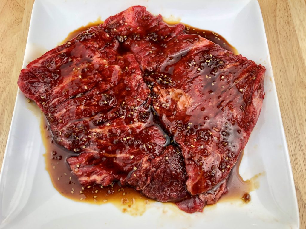 skirt steak marinating in gluten free teriyaki sauce