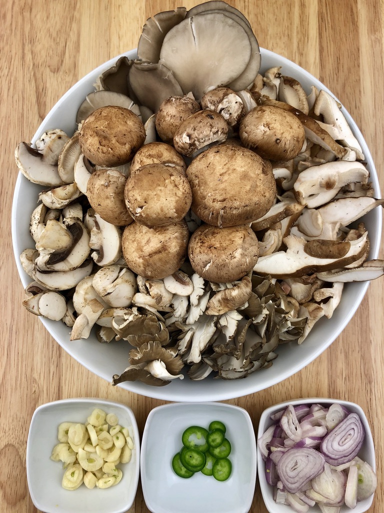 a variety of mushrooms with garlic, shallots and jalapeno