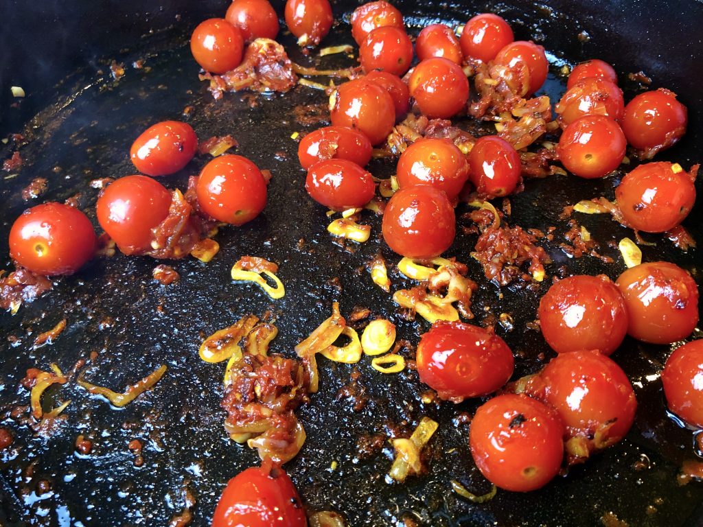let tomatoes cook and begin to softern