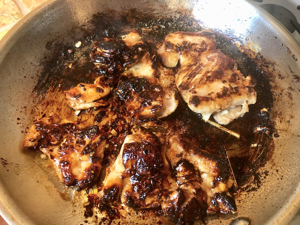 cooking marinated chicken thighs until caramelized and cooked through