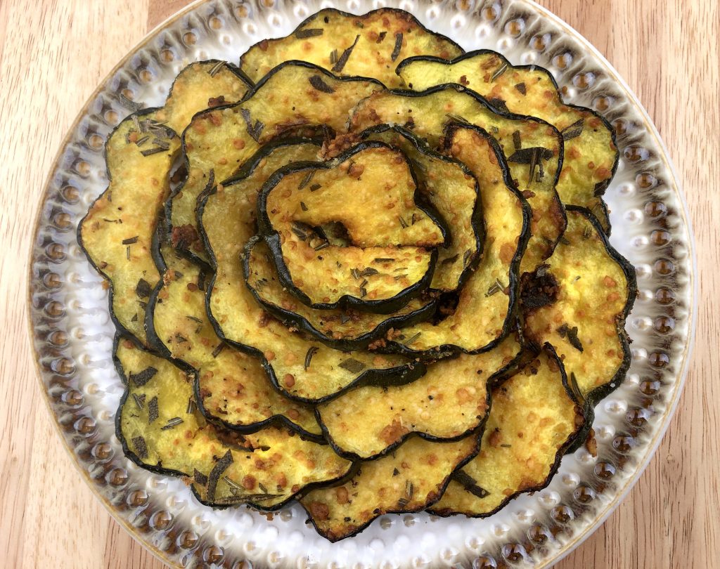 baked acorn squash presented as a flower on a plate