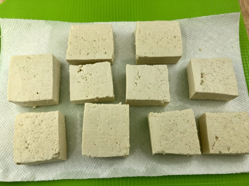 Place paper towel underneath tofu squares