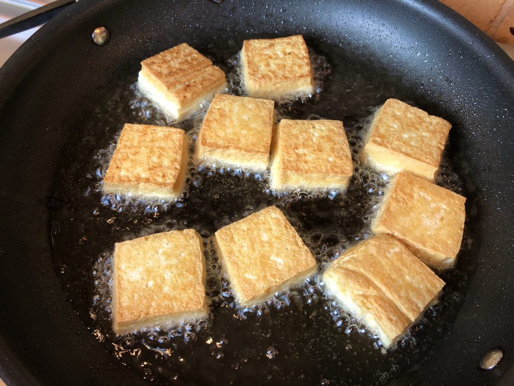 cooking second side of tofu squares