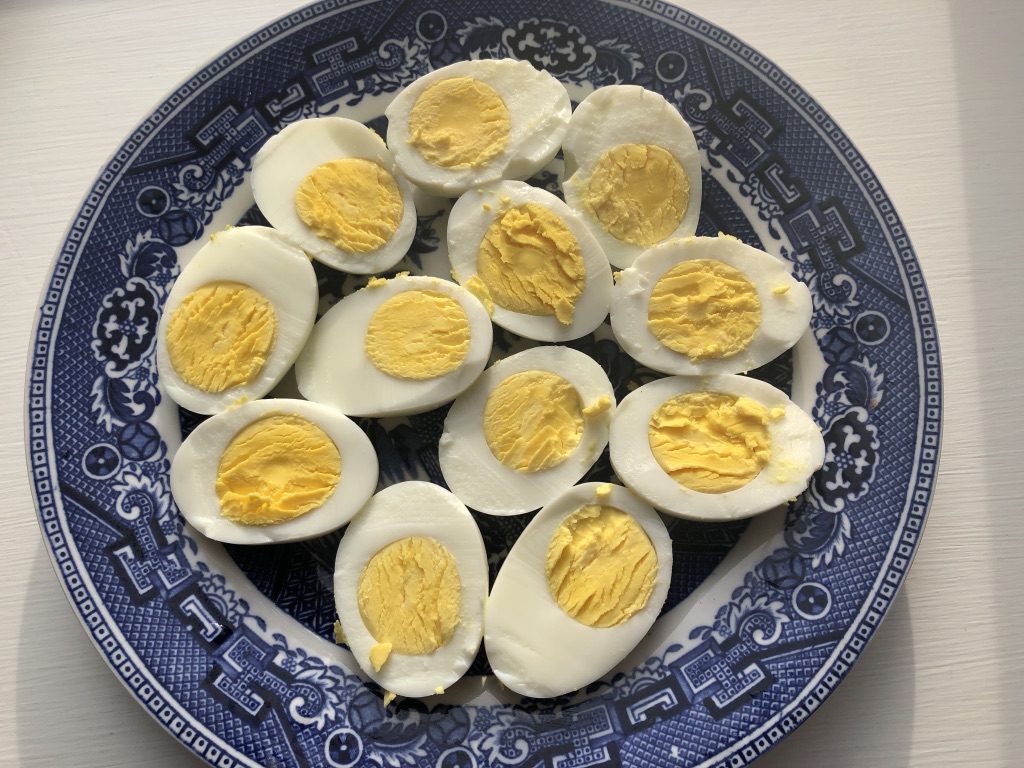 peel eggs and cut in half vertically