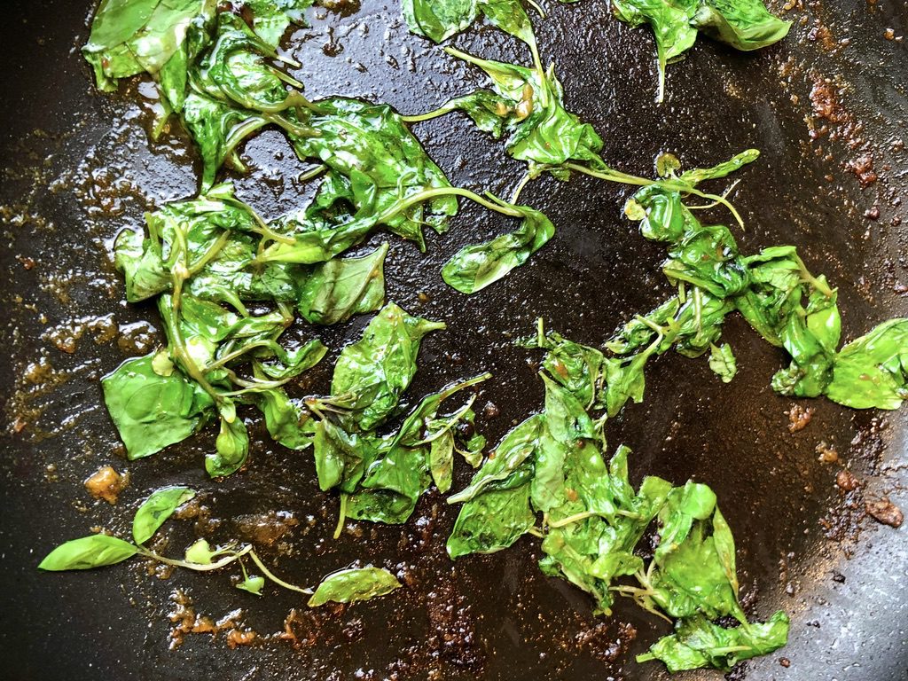 cook until basil leaves are wilted, less than 1 minute