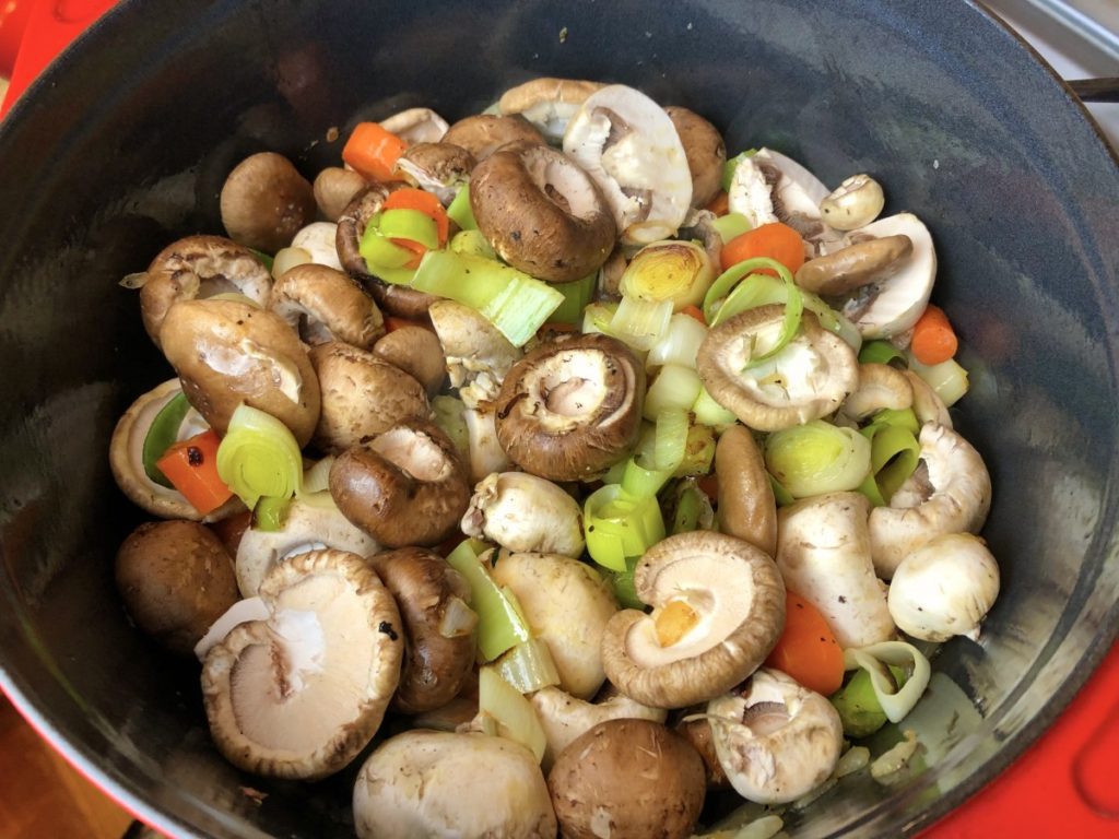 add mushrooms to the pot