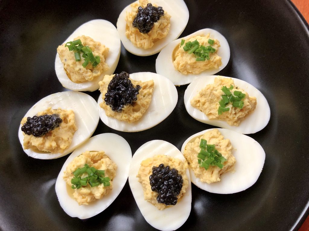 deviled eggs with caviar and chives