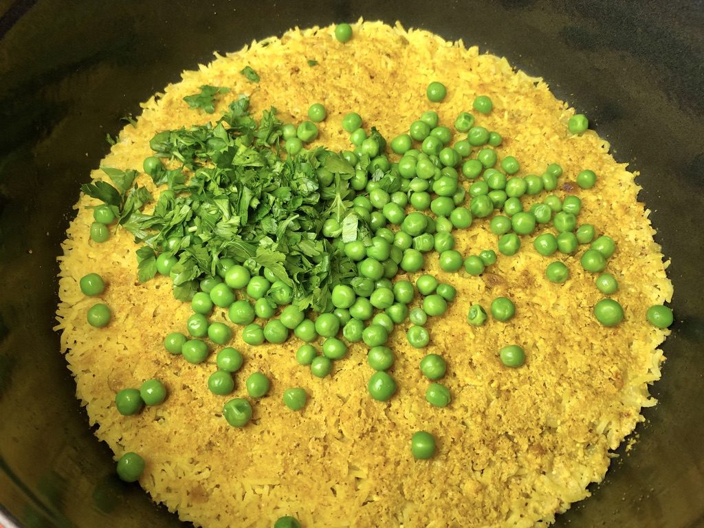 peas and parsley added to rice