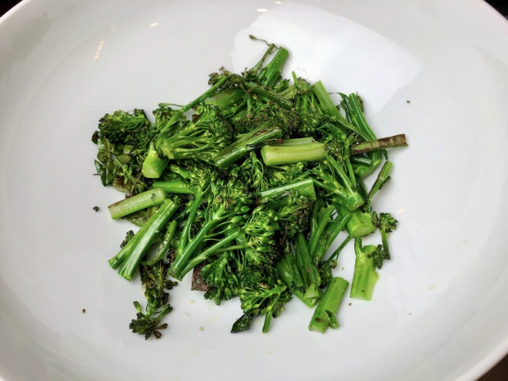 place sauteed broccolini in a bowl, set aside