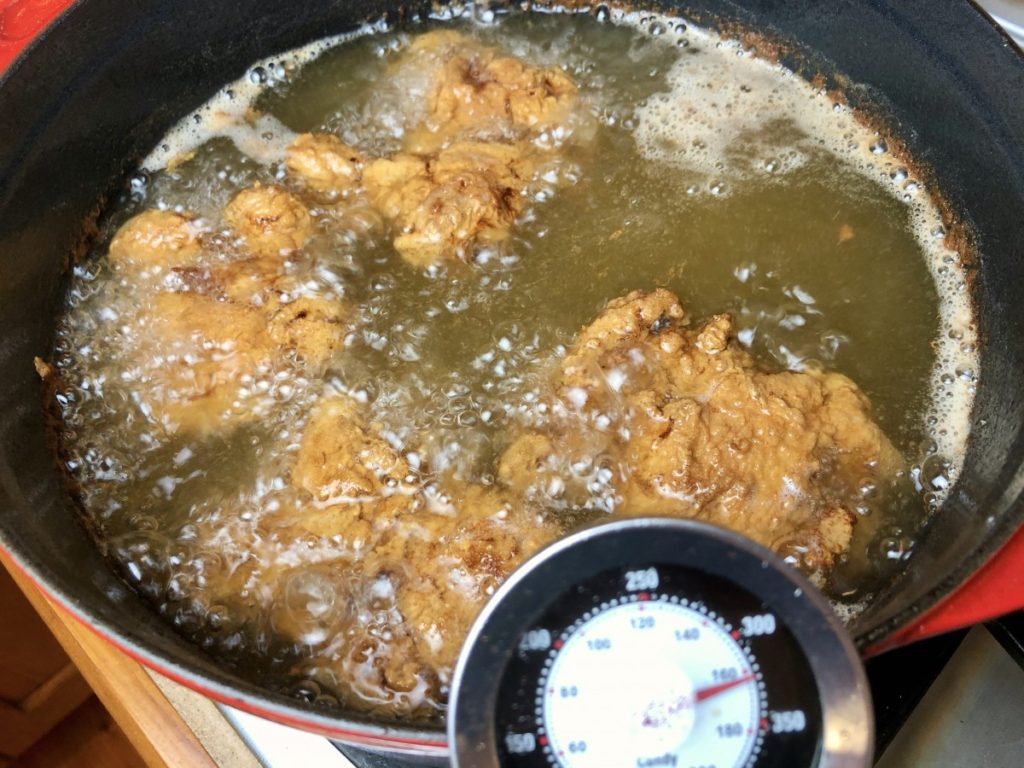 chicken cooking in oil