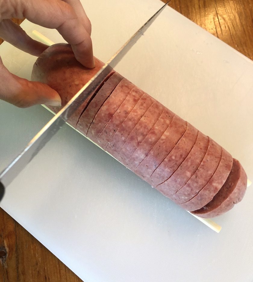 thinly slice salami making sure not to cut all the way through