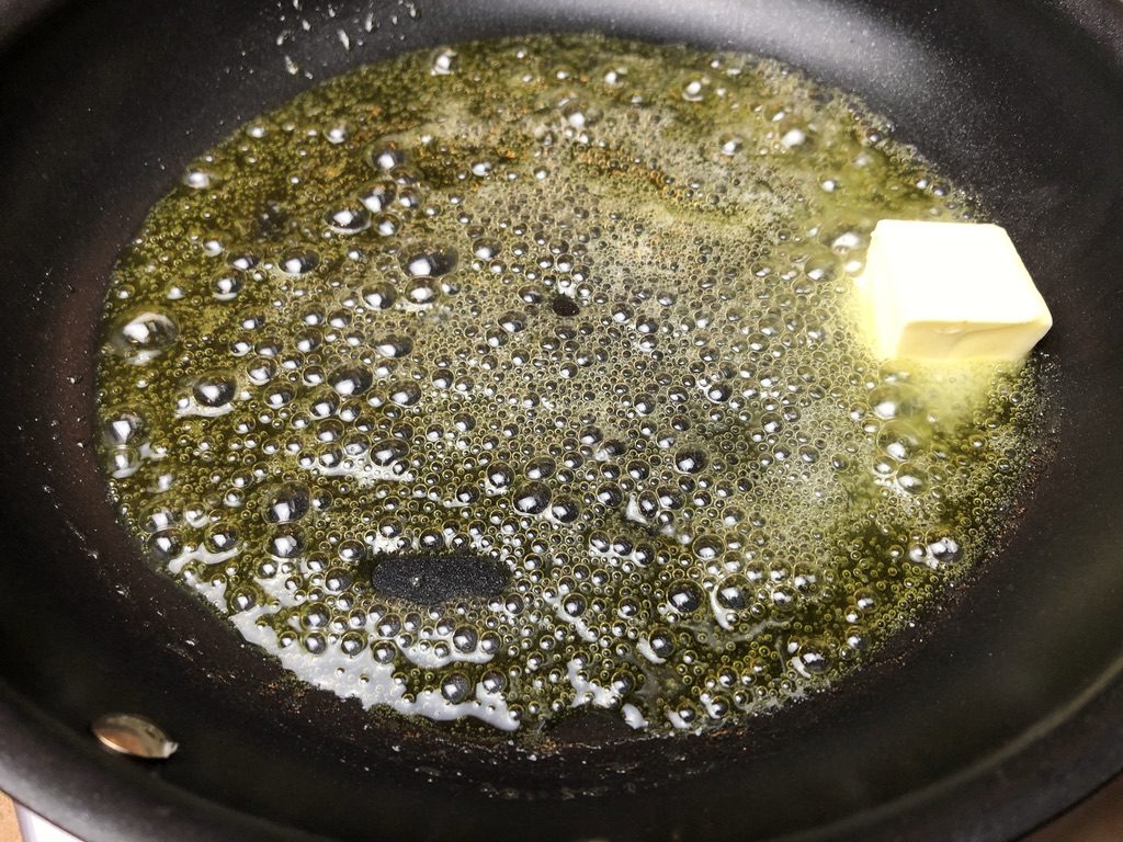 unsalted butter melting in pan