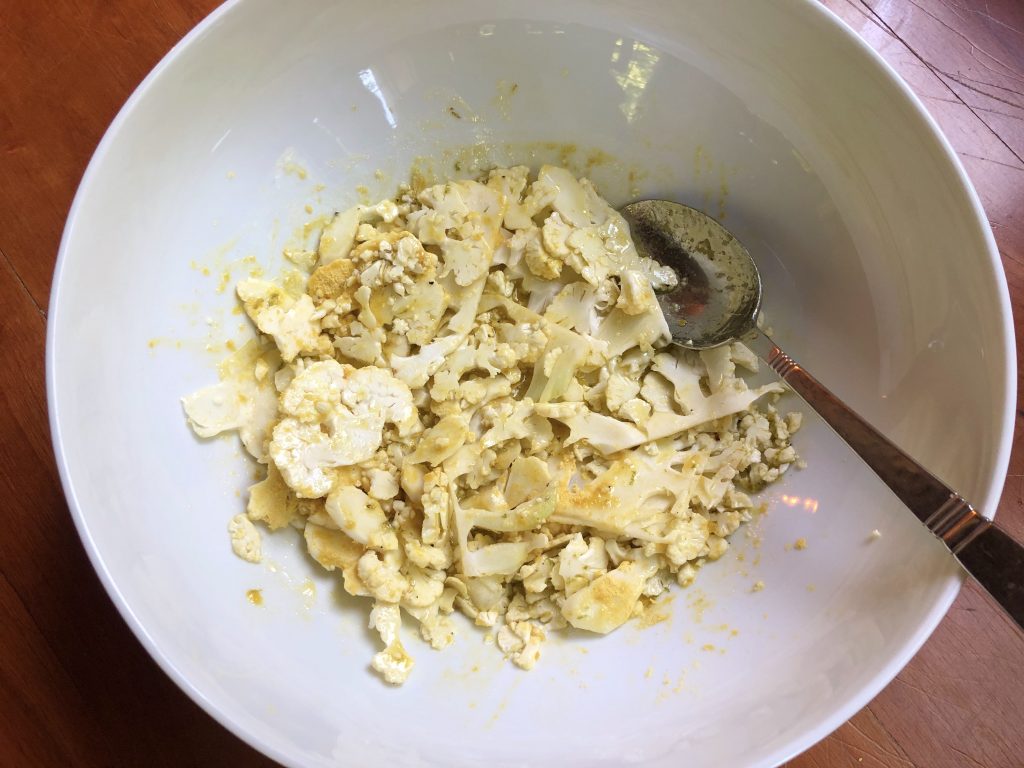 cauliflower and nutritional yeast mixed into dressing