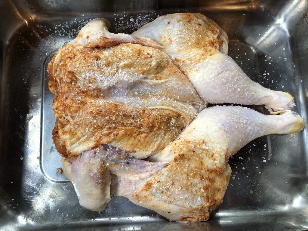 wet rub applied with fingers between skin and meat of chicken