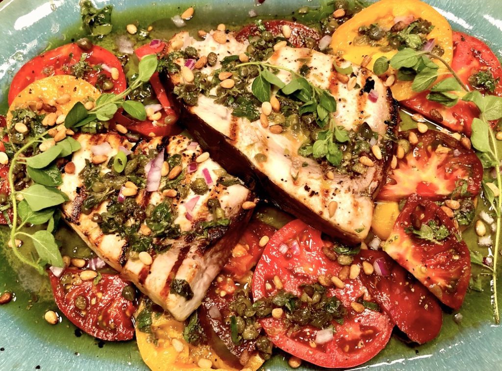 grilled swordfish, tomatoes and pine nuts with oregano-caper dressing