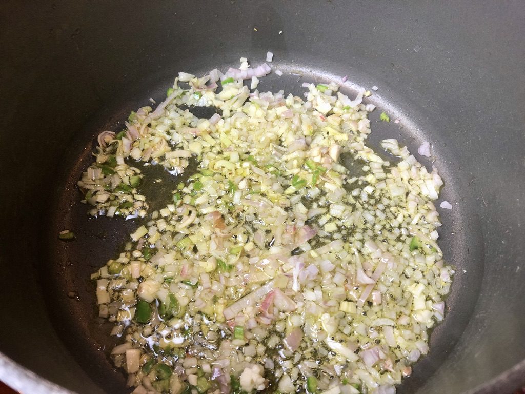 cooking the minced shallots, garlic, lemongrass and chiles