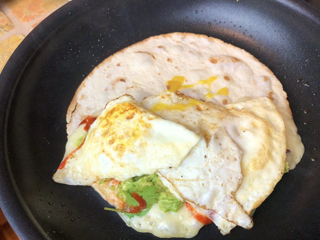 finish off the quesadilla with fried eggs