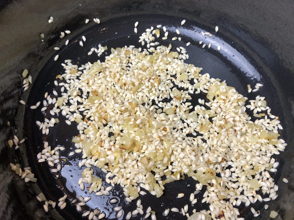 arborio rice added to sauteed onions and garlic