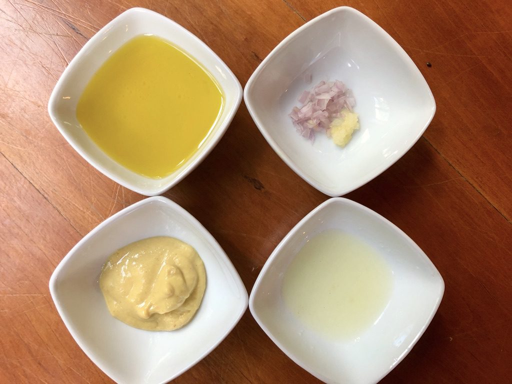 dressing ingredients: shallot, garlic, mustard, lemon, and olive oil