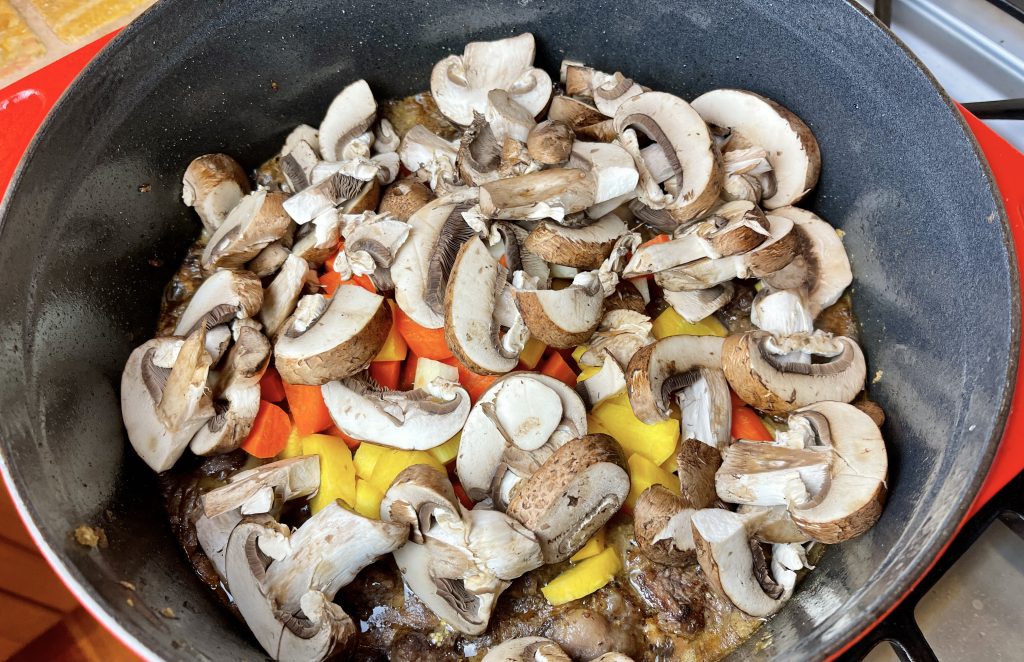 add carrots and mushrooms to the stew