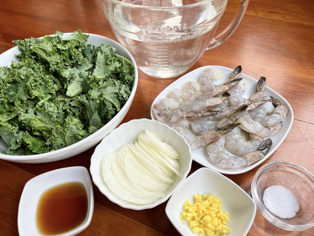 soup ingredients; onion, water, fish sauce, ginger, salt, greens, water, and shrimp