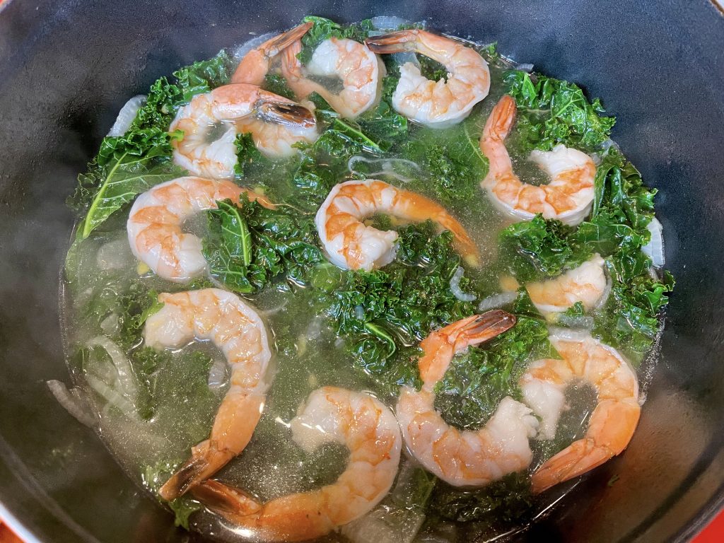 poaching the shrimp in the broth