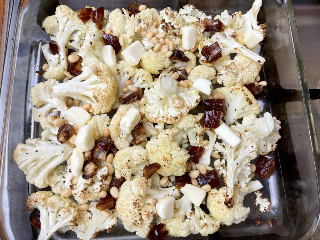 dates, pinenuts, butter, and garlic tossed with roasted cauliflower