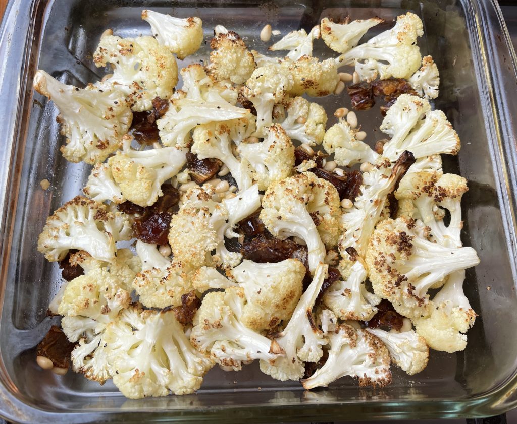 roasted cauliflower with toasted pinenuts, melted butter, softened dates and browned garlic