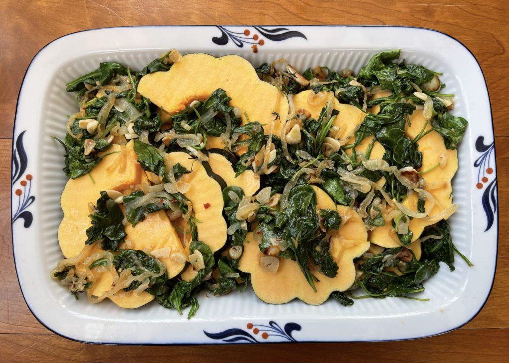 onion spinach mixture placed throughout the squash slices