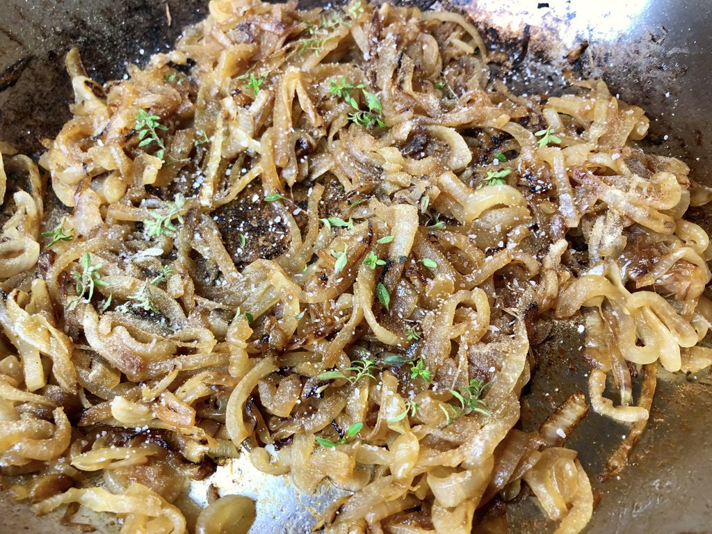 season caramelized onions with salt, white pepper, and thyme