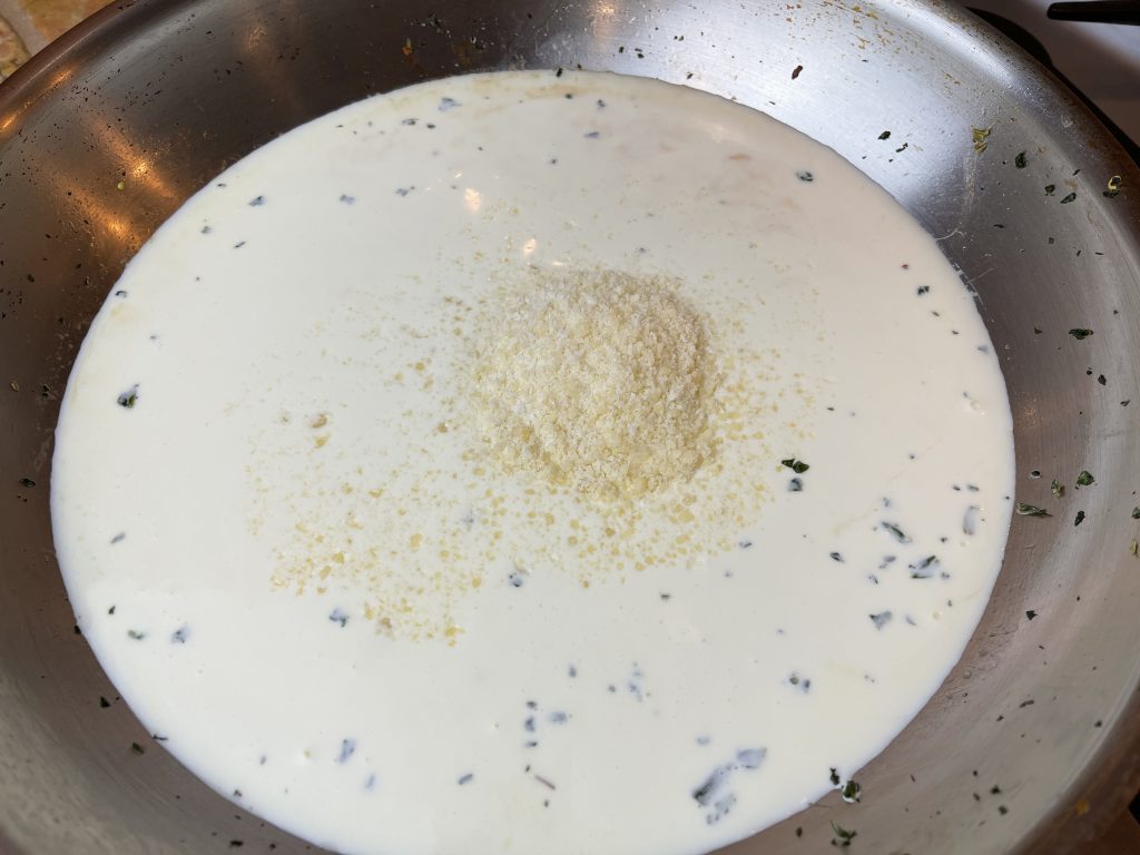 cream and parmesan in pan