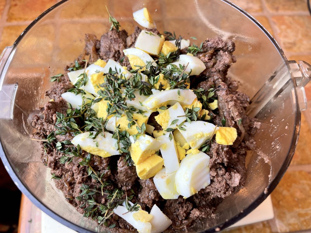 cooled liver and onions added to the food processor with thyme and chopped eggs