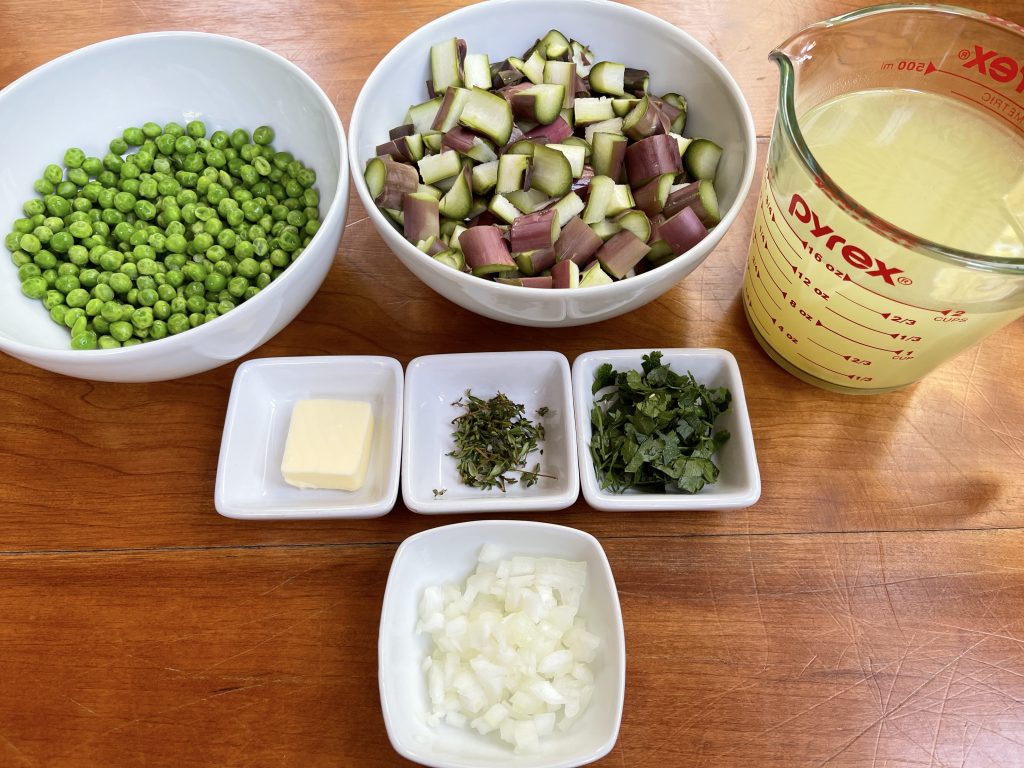 soup ingredients: peas, asparagus, broth, thyme, parsley, butter, and onion