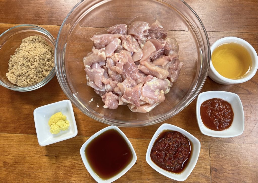 Chicken Skewer ingredients: light brown sugar, rice vinegar, hot chili paste (such as sambal oelek), fish sauce, sriracha, ginger, and chicken thighs