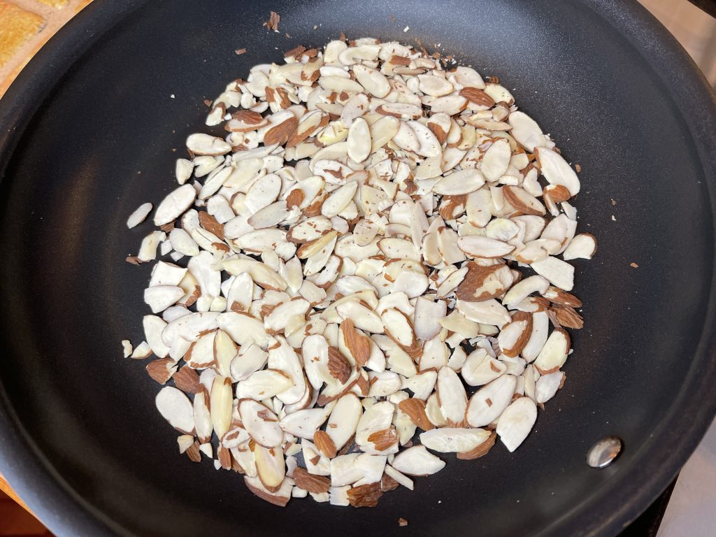 heat almonds in a medium sized, non-stick pan